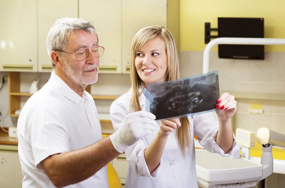 Dentist and assistant